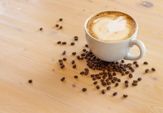 Coffee with Coffee Beans on the table